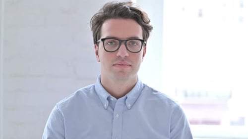 Man Smiling and Giving Thumbs Up Gesture