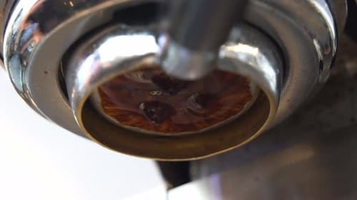 Cinematic close up shot,, .
Low angle close up view capturing the channel from coffee extraction,