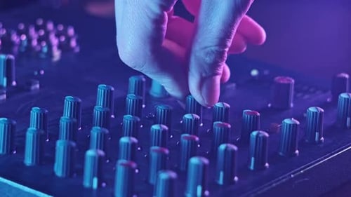 Adjust Volume Controls on the Audio Mixer in Neon Light CloseUp