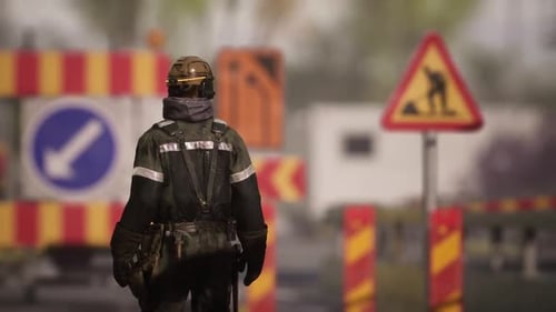 Worker Observes Safety Regulations Near Road Construction Site During Daytime