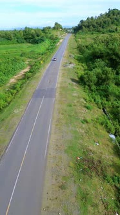 Aerial View of Road Through Green Landscape