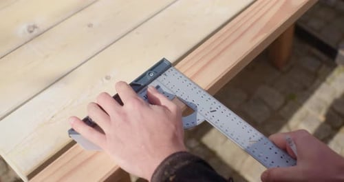 Close up of measuring and marking the wood