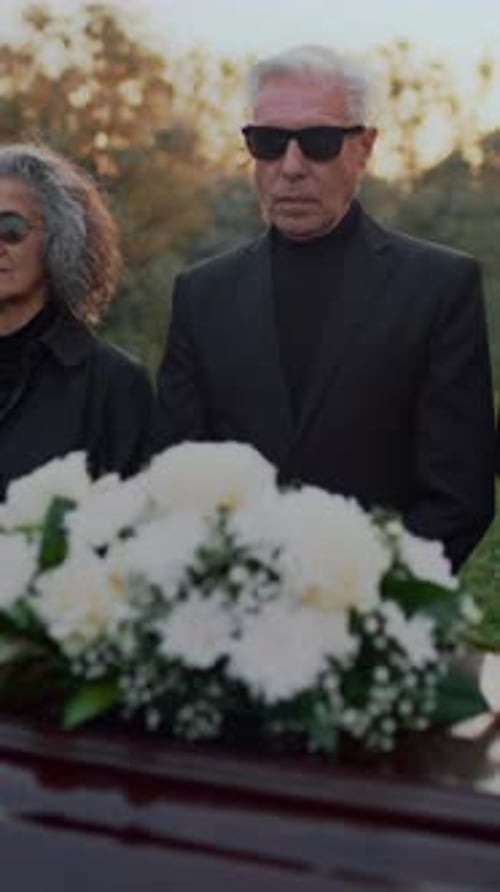 Elderly Parents at Funeral Farewell