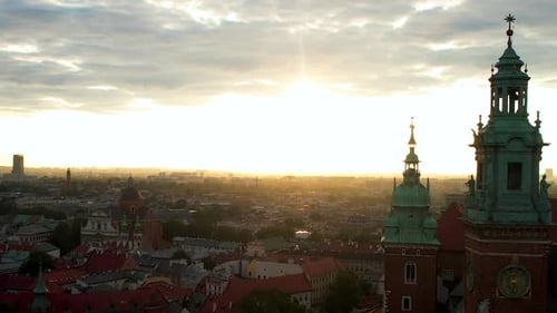 Scenic Sunrise Over Krakow City Center In Poland - aerial drone shot