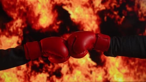 Boxers Fist Bump in Front of Fiery Background
