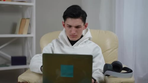 Young Adult At Home Looking Tired
