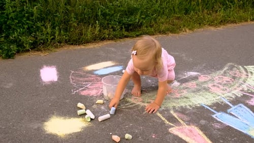 Children Draw with Chalk on the Pavement Selective Focus