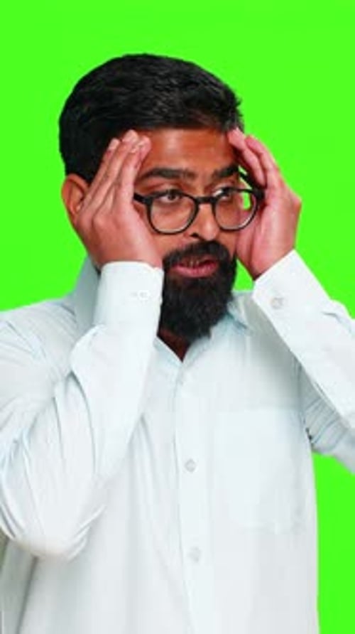 Indian Man Touching Temples with Fingers Showing Headache Pain or Mental Overload Stress Chroma Key