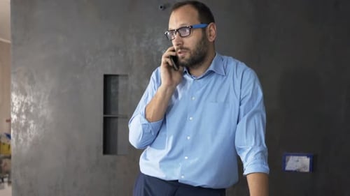 Architect talking on the phone in office