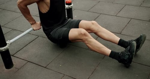 Male Exercising Doing Dips At Outdoor Gym