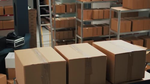 Warehouse Filled with Raw Materials and Racks to Put Cardboard Boxes