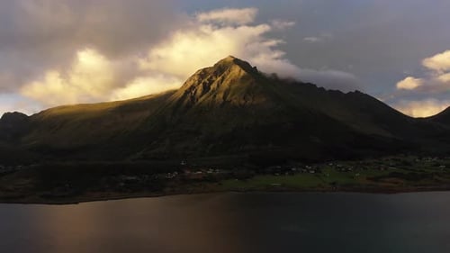 Very moody sunset with cloud formations on a mountain top in a Norwegian Fjord