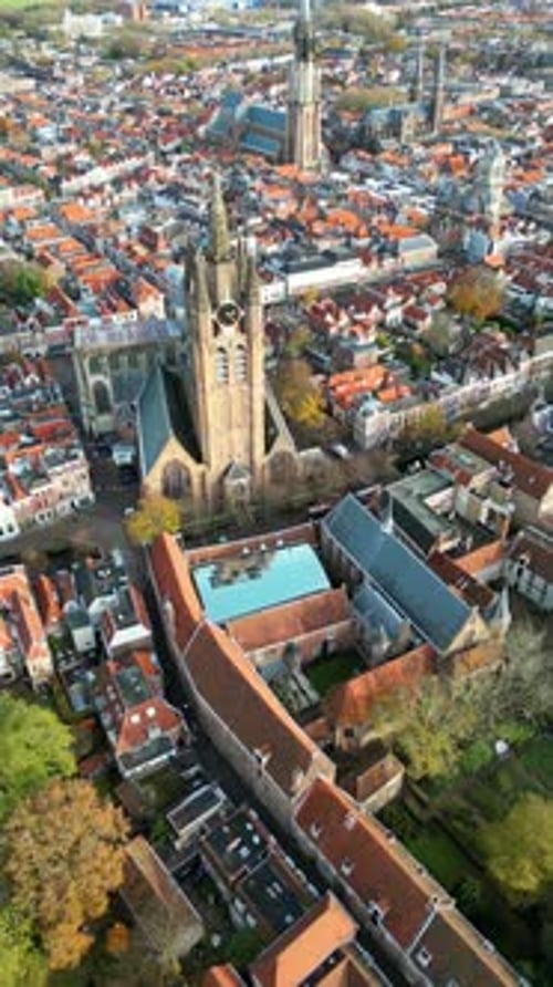Aerial drone view of the Nieuwe Kerk Protestant church in the city of Delft in the Netherlands. Vert