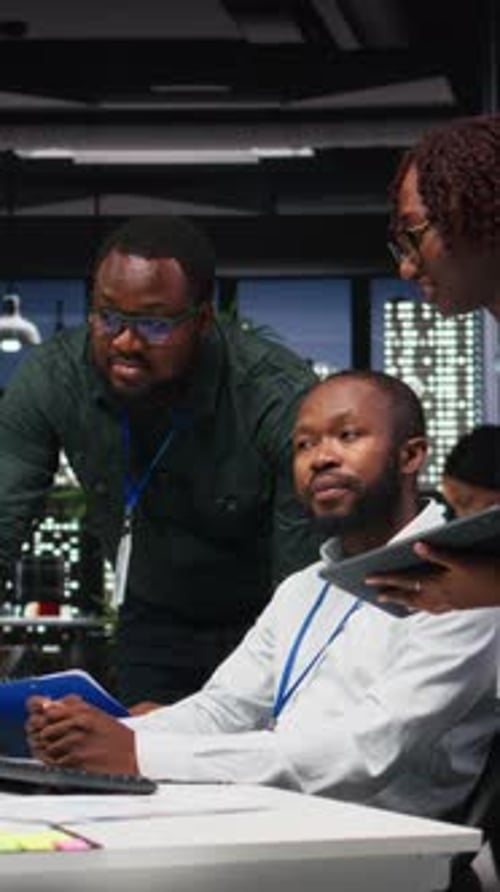 Vertical Video African American Staff Members Consulting Each Other for Monthly Reports