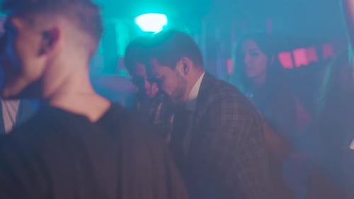 Young Adults Dancing Together at a Nightclub