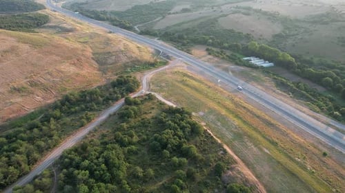 Aerial View of Highway Running Through Nature