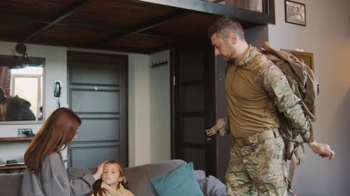 Family Saying Goodbye to Father in Military Uniform