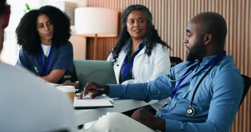 Man, team and doctors at documents, planning or discussion with workshop in office meeting