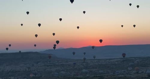 Aerial Cinematic Drone View of Colorful Hot Air Balloon Flying Over Cappadocia