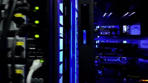 Close up of multiple rack-mounted servers in data centre