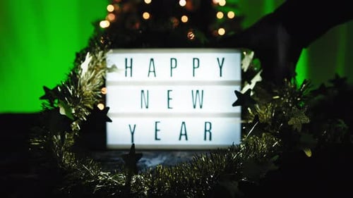 Happy New Year Sign with Christmas Tree Background