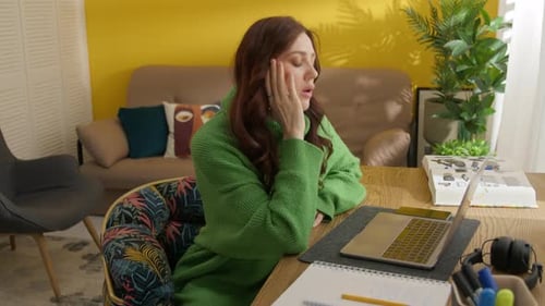 Stressed Woman Working at Home on Laptop