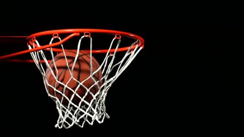 Basketball slow motion shot falls through hoop for a game winning play