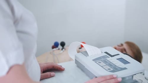 A Medical Clinic A Man Receiving a ECG Procedure A