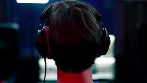 Close Up in the Recording Room Dark with Neon Lighting in the Studio the Sound Engineer Works at the