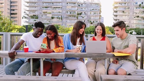 Young Adults Working and Relaxing Together Outdoors