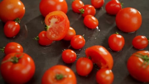 A Purple Tomato Falls Hits and Breaks Into Two Parts