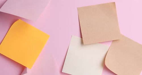 Colorful Sticky Notes and Tape on Pink Background