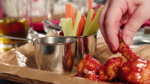 Crispy Fried Chicken Wings Cooking Pieces Sizzling in Hot Oil Inside a Deep Fryer in a Restaurant