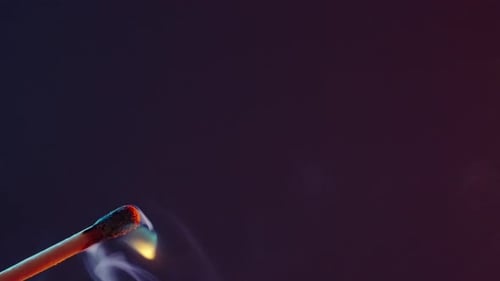 White Smoke From an Extinguished Match on Dark Background