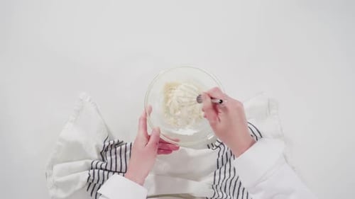 Mixing Ingredients in Bowl with Whisk for Baking