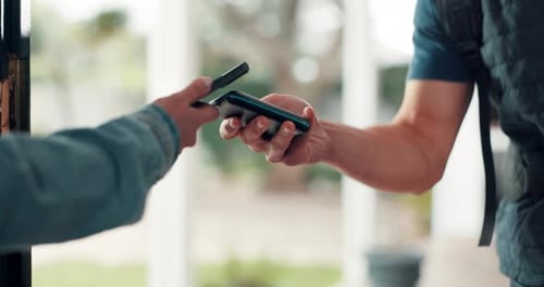 Man Paying with Phone via Contactless Payment