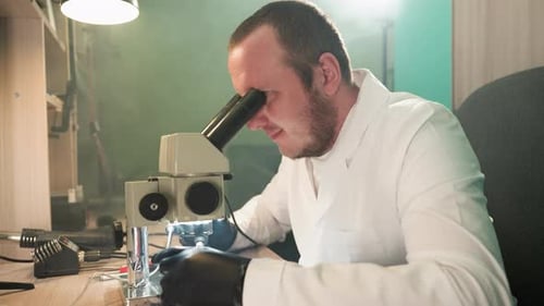 Scientist Using Microscope in Bright Laboratory