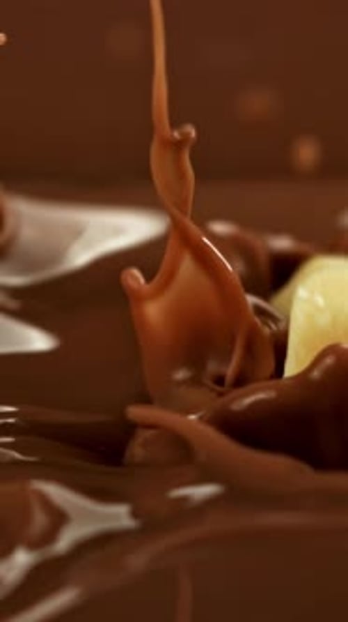 Chocolate Super Slow Motion White Chocolate Falls Into Milk Liquid Filmed on a Highspeed Camera at
