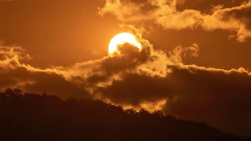 Fiery Sunrise Above Dark Mountain Range Time-Lapse