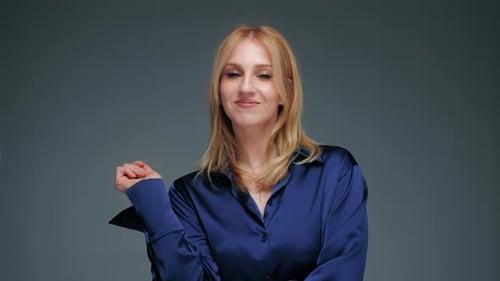 Smiling Woman Posing in Blue Shirt