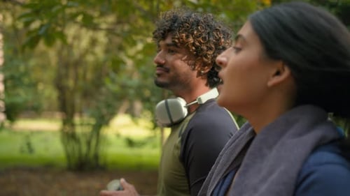 Young Adults Exercise Walking in Sunny Park