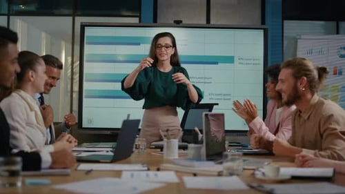 Business team celebrates success in modern office