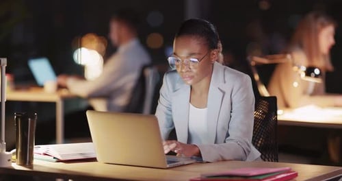 Young Smart AfroAmerican Office Executive Woman Using Portable Laptop Reading News Performing Duties