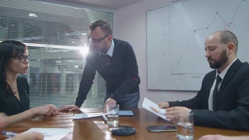 Business Meeting: Team Collaboration in a Modern Office