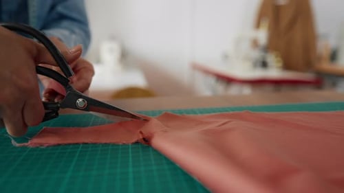 Fashion Atelier Lady Seamstress Cutting Clothes Closeup of Hands with Scissors Creative Hobby and