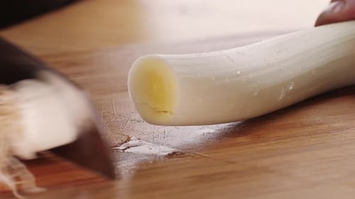 Chef Chopping a Leek White Onion with a Knife on the Cutting Board Macro Close Up of Cutting Red