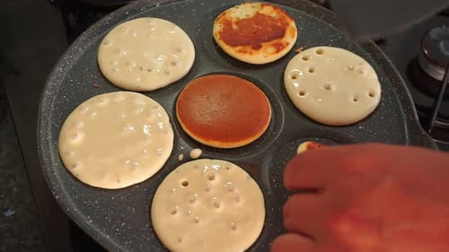 Flipping Golden Pancakes on the Stove