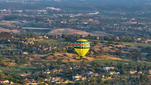 Hot Air Balloon over Suburban Landscape