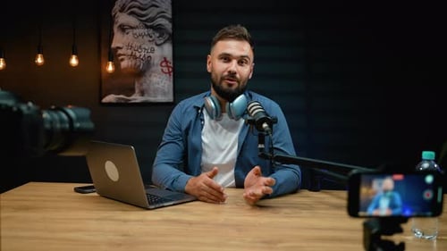Man Recording a Podcast in Home Studio