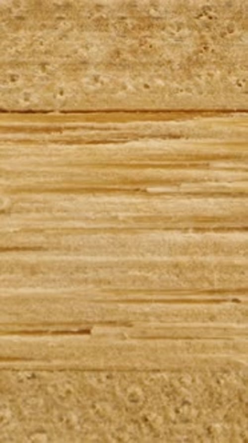 Vertical video. Knocked-down, smooth rectangular wooden shavings, macro texture. Slider.